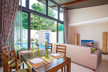 Dining and Living Area with Pool and Garden View
